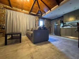 a living room with a couch and a table at Villa Bournous in Mesokhória
