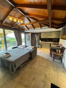 a large bedroom with a large bed and a kitchen at Villa Bournous in Mesokhória