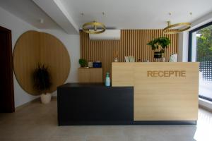 a reception desk with areciprocal sign in a lobby at YRYS House - Adults Only in Eşelniţa +47 photos