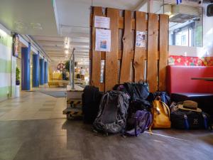 a room with a bunch of bags on the floor at Eurohostel in Helsinki