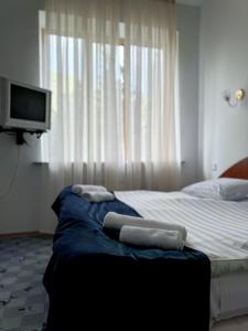 Postel nebo postele na pokoji v ubytování Blue Sevan Hotel