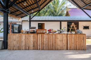 a wooden fence in front of a house at Kokotel Khao Lak Lighthouse in Khao Lak