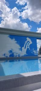 a reflection of the sky in a pool of water at Albergo Ristorante Madonnina in Cantello