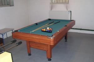 a pool table with cue balls on top of it at Bed & Breakfast Bigalke in Hamburg
