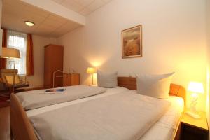 Postel nebo postele na pokoji v ubytování Appartementanlage Ostseeblick - FW Wustrow 9 rolli-gerecht