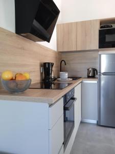 Kuchnia lub aneks kuchenny w obiekcie Apartmani Nila
