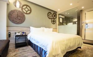 Letto o letti in una camera di Walker Hotel. Ximen