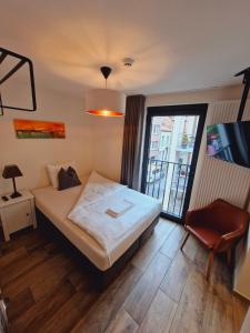 Postel nebo postele na pokoji v ubytování Hotel Ladeuze