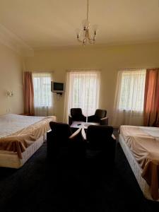 Postel nebo postele na pokoji v ubytování Blue Sevan Hotel