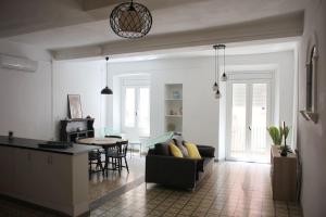 a living room with a couch and a table at El Terrer 1834 Apartament in Santpedor