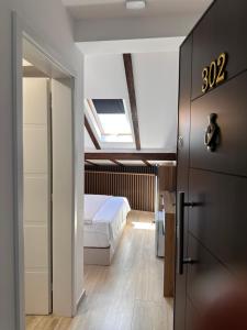 Postel nebo postele na pokoji v ubytování Treva Hotel & Apartaments