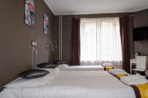 Postel nebo postele na pokoji v ubytování Hotel Flipper Amsterdam