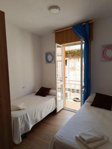 Postel nebo postele na pokoji v ubytování Pilgrim Rooms + 43 fotografií