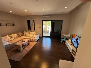 a living room with a couch and a table at Apartment Verano in Njivice