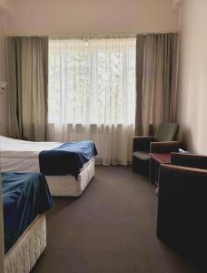 Postel nebo postele na pokoji v ubytování Blue Sevan Hotel