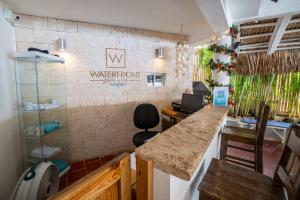 an office with a counter and a water room sign on the wall at Bungalow #10 at Waterfront Playa Alicia in Sosúa