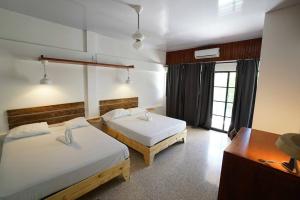 Postel nebo postele na pokoji v ubytování Room #29 at Waterfront Playa Alicia