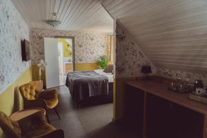 Postel nebo postele na pokoji v ubytování Vanalinna Boutique Hotel