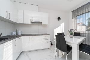 Køkken eller tekøkken på Villa Marimela luxury apartments