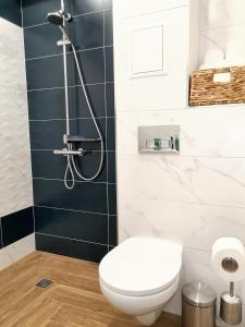 a bathroom with a toilet and a shower at "Петър 27" Апартамент До Плажа С Паркинг "Peter 27" Top Center And Private Parking in Burgas City