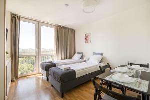 Posteľ alebo postele v izbe v ubytovaní Labo Apartment Żelazna Brama