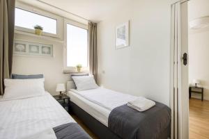 Posteľ alebo postele v izbe v ubytovaní Labo Apartment Żelazna Brama