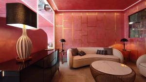 a living room with a couch and a table at Hotel Ritual Torremolinos- Adults Only in Torremolinos