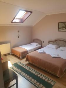 Postel nebo postele na pokoji v ubytování Guest house Vila Bor