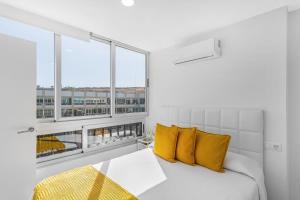 Ένα ή περισσότερα κρεβάτια σε δωμάτιο στο Newly Refurbished Beachfront +20 φωτογραφίες