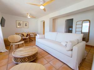 a living room with a white couch and a table at Casabella La Terrasse in Altea