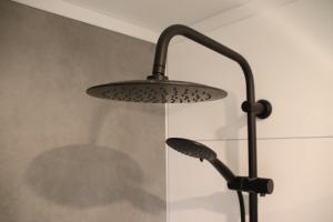 a lamp hanging from a wall in a room at Boshuis Dreamstay Gorssel in Gorssel +25 photos