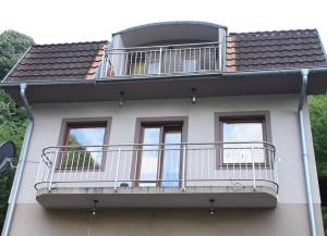 a balcony on the side of a house at Guesthouse Ema in Banja Luka
