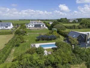 an aerial view of a house with a swimming pool at Westaway House in Port Isaac