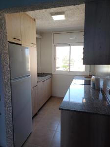 Kuchyň nebo kuchyňský kout v ubytování Miami APARTAMENTO THOMAS