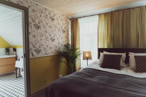 Postel nebo postele na pokoji v ubytování Vanalinna Boutique Hotel