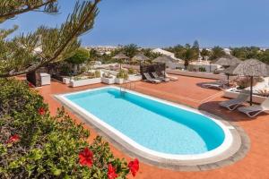 an image of a swimming pool at a resort at Golf y Mar B Suites in Costa Teguise