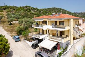 an aerial view of a house with cars parked in front at PANORAMA in Potos