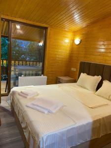 Postel nebo postele na pokoji v ubytování Dililuxe Hotel