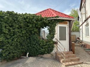 a small house with a red roof at Любимый in Cholpon-Ata