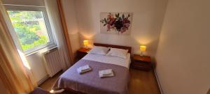 Posteľ alebo postele v izbe v ubytovaní Apartment Sime