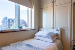 Postel nebo postele na pokoji v ubytování AVALON HOUSE