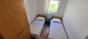 Posteľ alebo postele v izbe v ubytovaní Apartment Sime