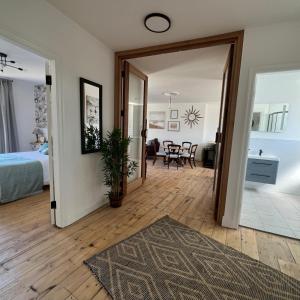 a room with a door open to a bedroom at MOREaccom Maisonette in Morecambe