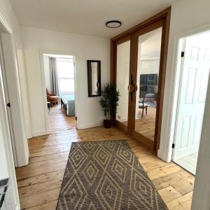 a hallway with a door leading to a bedroom at MOREaccom Maisonette in Morecambe