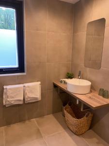 a bathroom with a sink and a mirror at The Lodge in Best
