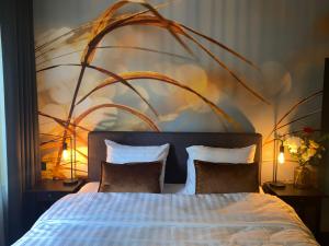 a bedroom with a large bed with two pillows at The Lodge in Best +18 photos