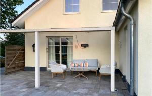 a patio with a table and chairs and a house at Horsterhoek in Zeewolde +24 photos