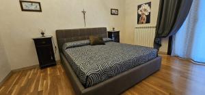 Postel nebo postele na pokoji v ubytování B&B Della Via Francigena