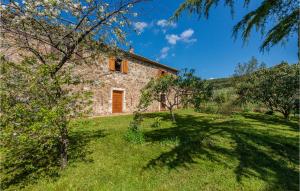 an external view of a stone house with trees at Stunning Home In Massa Marittima Gr in Massa Marittima
