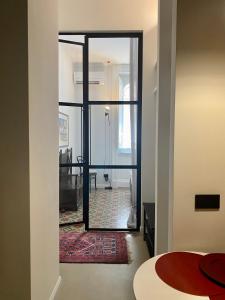 a room with a door leading to a living room at Casa 3D'Oro Palermo in Palermo +34 photos